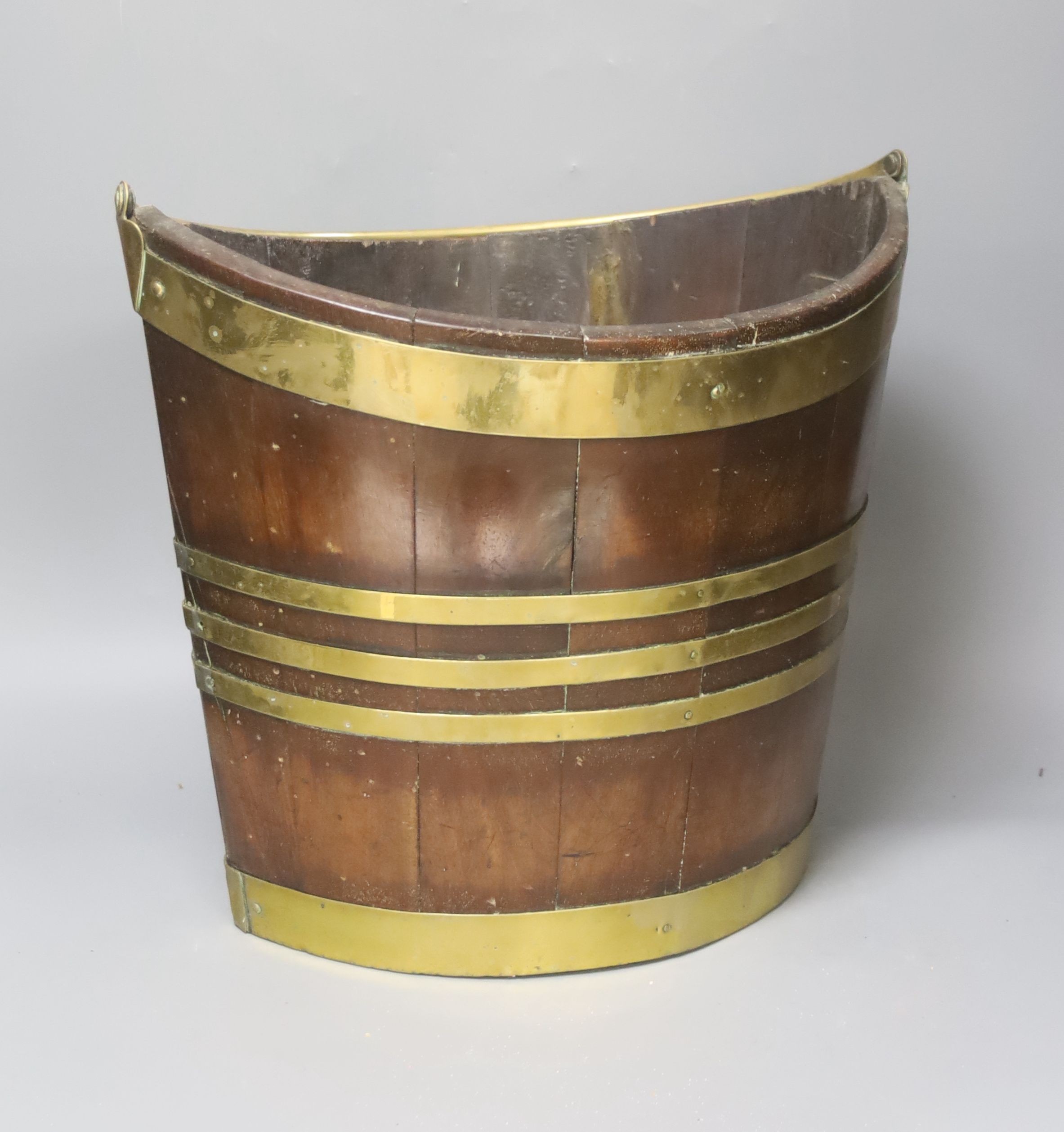 An early 19th century Dutch mahogany and brass bound oyster or peat bucket 33cm